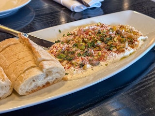 Herb and Chile Whipped Feta with olive oil and fresh herbs from Brasserie 23 near South Bend, IN.