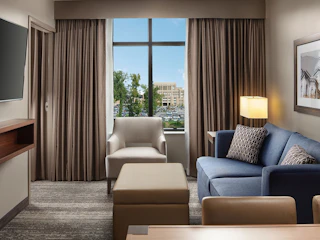 A hotel room at Embassy Suites with views of Notre Dame campus from the window