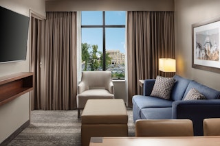 A hotel room at Embassy Suites with views of Notre Dame campus from the window