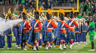 The Irish Guard walking along the field in the football stadium
