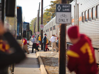 Visitors stepping out of trains and onto buses in South Bend