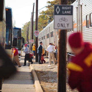 Visitors stepping out of trains and onto buses in South Bend