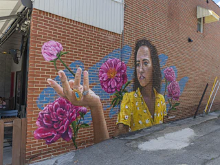 "Let It Grow" mural on the side of Hammer & Quill in the East Bank Village of Downtown South Bend.