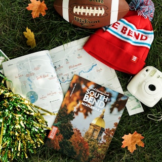 A copy of the 2025-2026 Fall/Winter Experience Guide featuring the University of Notre Dame's golden…