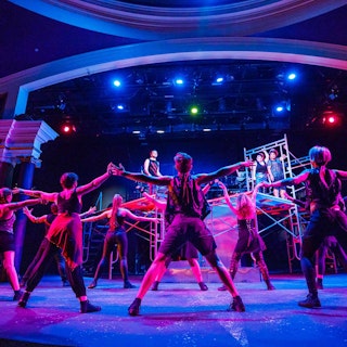 Actors on a stage at the South bend Civic Theatre with dramatic lighting