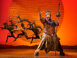 A scene from Broadway's The Lion King featuring Rafiki
