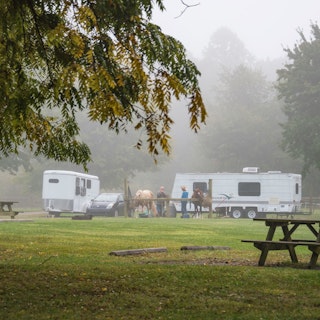 A wideshot of campers and their horse at Potato Creek State park