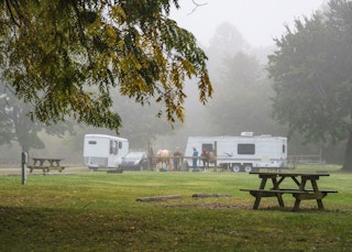 A wideshot of campers and their horse at Potato Creek State park