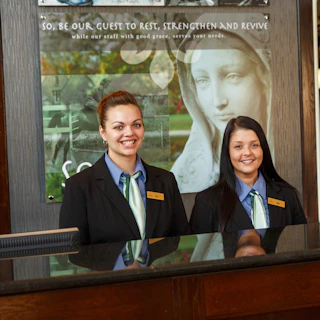 Front desk employees at the Inn at Saint Mary's