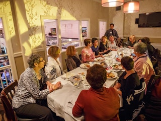 A group of ladies enjoy dinner at Cafe Navarre in downtown South Bend