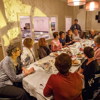 A group of ladies enjoy dinner at Cafe Navarre in downtown South Bend